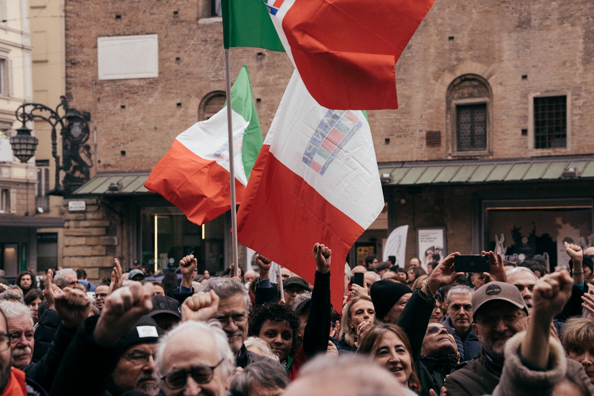 A large group of people standing in front of a building